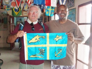Rick and Terry holding the Flag of Little Farmer's Cay