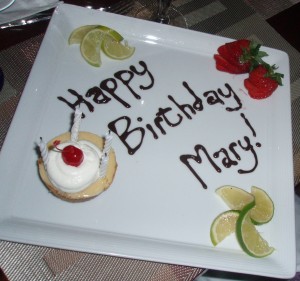 Plate with Key Lime Tartlett and Happy Birthday Mary written in chocolate frosting