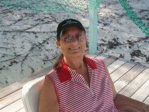 Charlene sitting in pavilion on Crescent Beach
