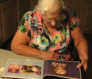 Rick's Mother Looking at the Memory Photo Book We Gave Her