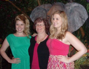 Shay, Mary and Christina standing in front of an elephant at the Rain Forest Cafe