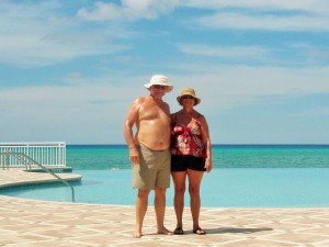 Ken and Jackie in front of the Bimini Sands Resort's infinity pool overlooking the beach