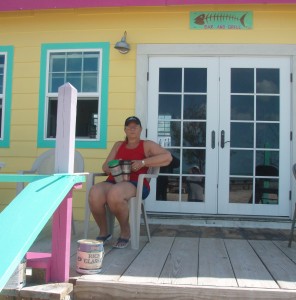 Charlene sitting on porch of Bonefish Bar and Grille