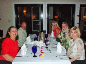 Charlene, Tokkie, Gail, Kevin and Karen sitting at dinner table at Fowl Cay's Hill House Restaurant