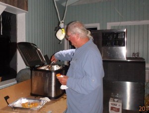 Rick cooking conch fritters in a turkey fryer