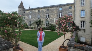 Charlene standing in front of Castle Chateau Lamothe