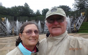 Charlene and Rick in front of fountains in the ballroom garden