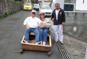 Rick and Charlene in toboggan basket with handler