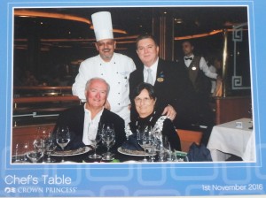 Rick and Charlene seated with Chef and Maitre D standing behind