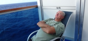 Rick sleeping in deck chair on balcony