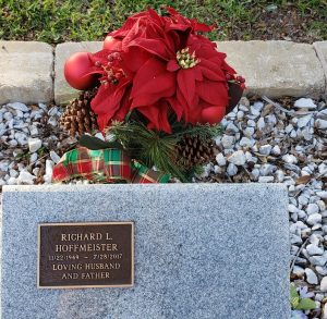 Poinsettia at Rick's memorial stone