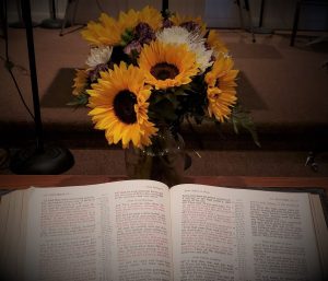 Sunflower arrangement on alter with Bible