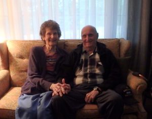 Dad and his cousin Mary Ann sittin on couch