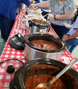 Table with pots of chili