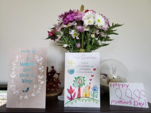 Mothers' Day cards and flowers in vase