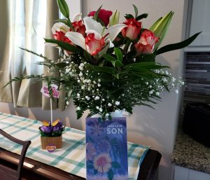 Bouquet of roses and lilies with Mother's Day card