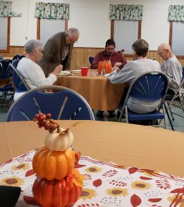 people eating seated at a table