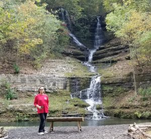 Charlene standing in front of Thunder Falls