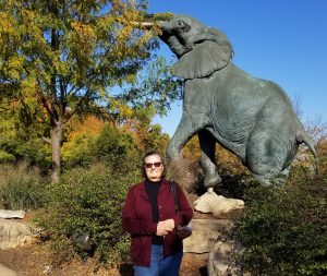 Charlene in front of an elephant statue