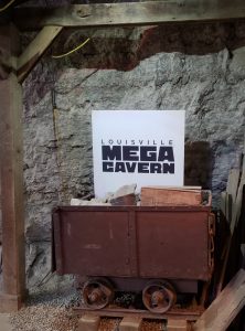 Louisville Mega Cavern Sign in a mining car