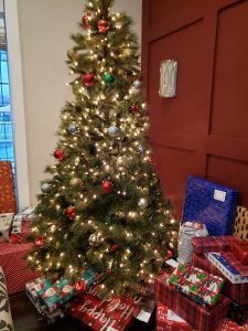 Family Christmas tree with lots of presents