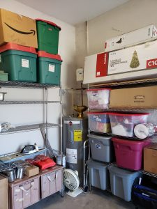 Metal Shelving with bins and boxes of Christmas decorations