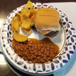 Cheeseburgers, Fritos and Baked Beans on a plate