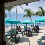 View from our table of outside tables and gulf beach