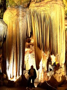 Gold and white stalactites surounding Jackie