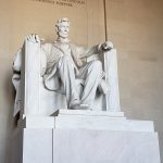 Marble statue of President Lincoln sitting in a chair