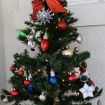 4-foot Christmas tree with ornaments and a red box on top