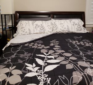 Bed with black and white bedding