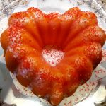 Heart-shaped bundt cake with red sprinkles